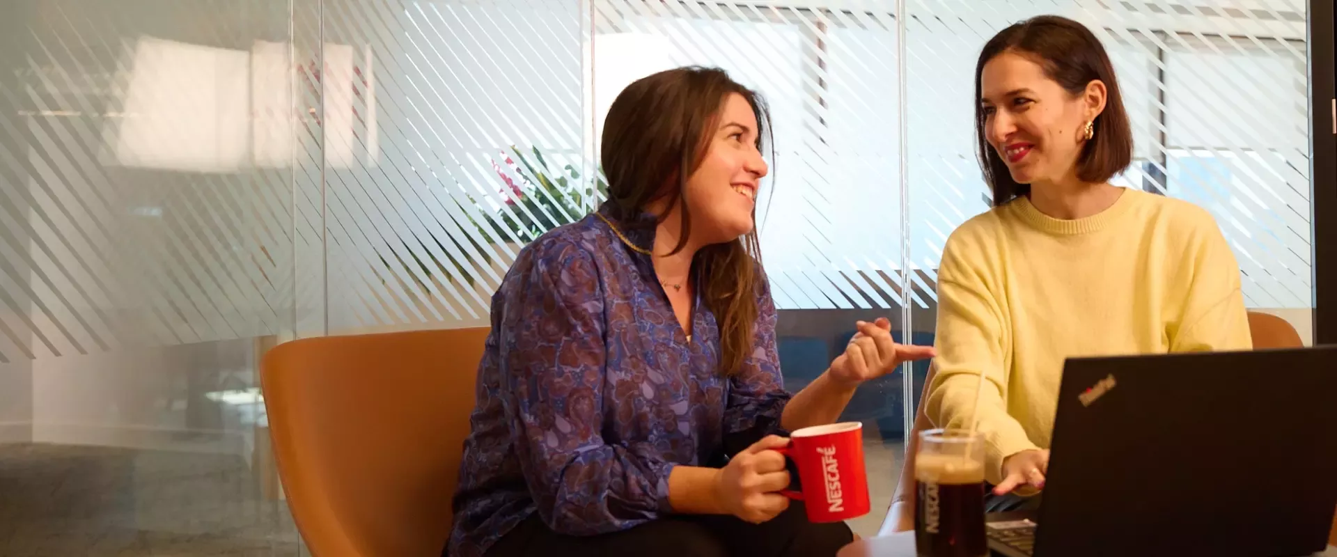 two colleagues smiling