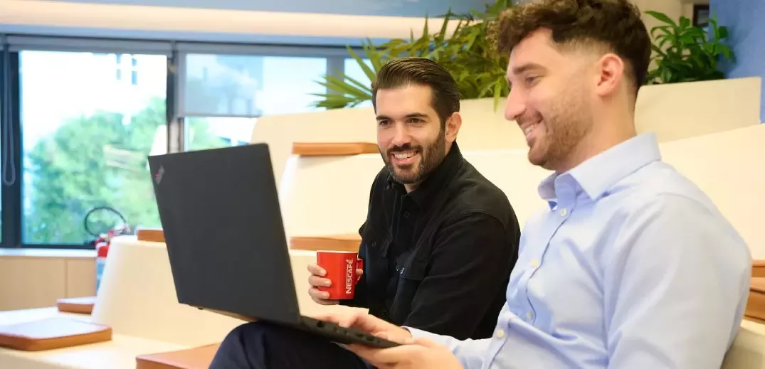 two colleagues working on laptop